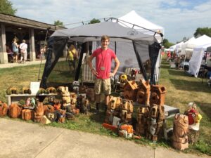 Jack Ward with Chainsaw Carvings by Colony Carvers, Amana, Iowa